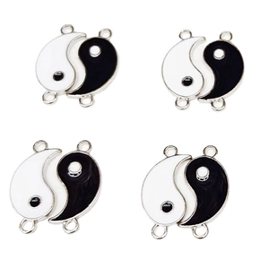 Set of four yin yang tai chi charms in black and white enamel for DIY jewelry making