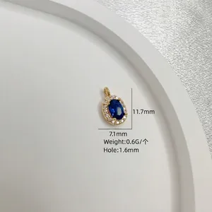 Gold oval S925 silver pendant with blue gemstone and white zirconia pavé detail