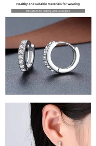 Macro detail of silver hoop earrings with pavé set white cubic zirconia crystals
