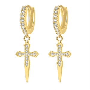Detailed view of gold plated cross earrings with sparkling white cubic zirconia stones