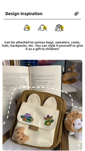 Detailed view of cartoon cactus and purple bus enamel pins on a canvas tote bag