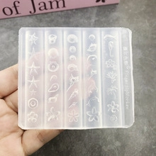 Detail showing multi-pattern silicone nail art mold with stars and flowers for DIY resin