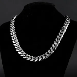 Mens thick polished silver stainless steel Cuban link chain necklace shown on neck model