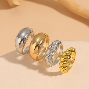 Set of four minimalist 14K gold and silver plated rings with smooth and twisted textures