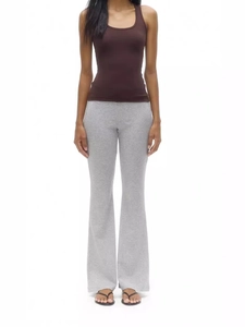 Women's grey flared yoga pants with high waist and brown tank top on a white background