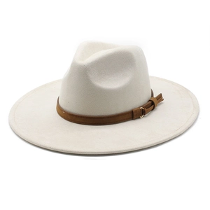 Macro shot of faux suede fedora with brown leather band and gold metal buckle detail