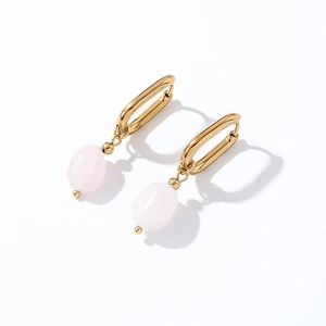 Detailed view of elegant pink natural stone drops on minimalist gold geometric earrings