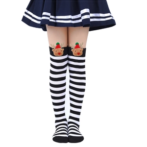 Detail of striped over-the-knee Christmas socks with plush 3D reindeer doll attachment
