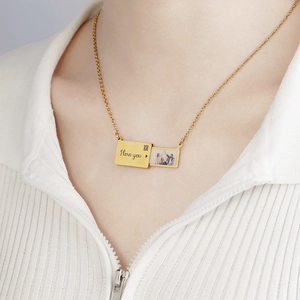 Custom gold envelope photo locket necklace with I Love You engraving and pull-out design