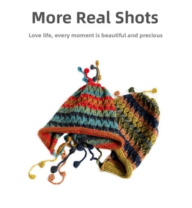 Detail of colorful knitted earflap hats with multi-color pompom ties and thick texture