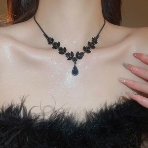 Macro shot of elegant black rhinestone wheat-ear necklace with a water-drop pendant