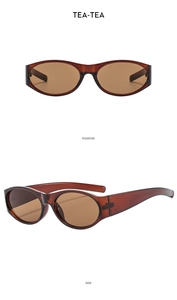 Detail view of retro oval sunglasses in translucent amber tea color with side temples