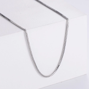 Detailed view of silver stainless steel box chain necklace showing intricate link texture