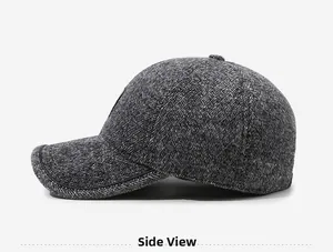 Side view of men's dark grey herringbone flat cap featuring premium fabric texture
