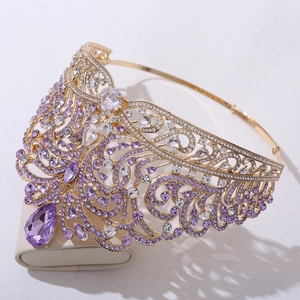Luxury gold crown featuring purple crystals and rhinestones for pageant and wedding