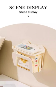 Wall-mounted white wet wipe dispenser showing storage shelf with remote and tissue slot