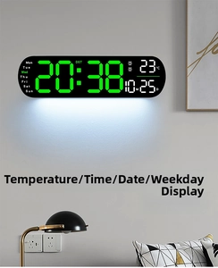 Detailed LED digital wall clock display showing time, green digits, temperature and date
