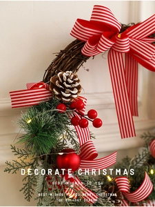 Close-up of rustic Christmas wreath with LED lights, red berries and pine cones