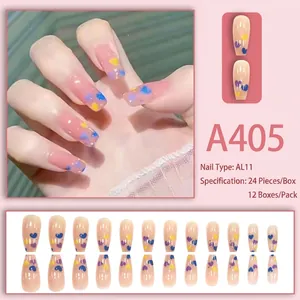Pink press-on nails with colorful heart patterns in a 24-piece long coffin shape set