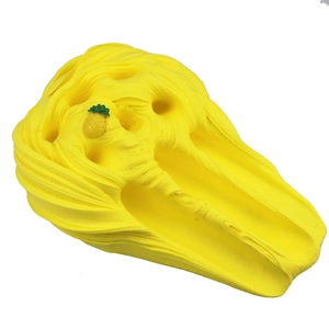 Detailed texture of yellow butter slime toy with a small pineapple charm accessory