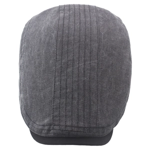 Detail shot of washed grey cotton flat cap showing twill texture and vertical stitching