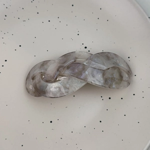 Detail of grey marble pattern acetate hair clip with FRANCE Handmade engraving