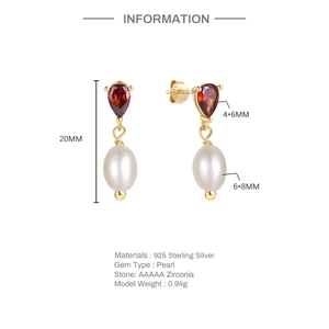 Close-up of S925 silver earrings with ruby zircon and pearl details, 20mm height
