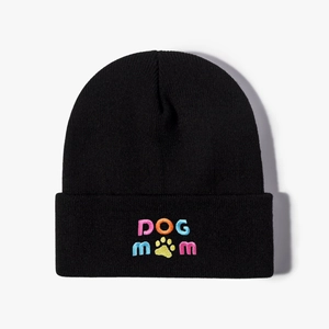 Classic black knit beanie featuring colorful DOG MOM embroidery and yellow paw print