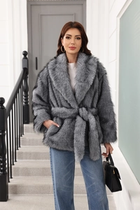 Detailed texture of grey faux fur coat with belted waist and premium plush long sleeves