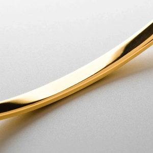 Minimalist open-ended gold stainless steel cuff bracelet with mirror-polished finish