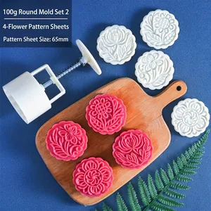 Detail of 100g hand-press mooncake mold with four 65mm circular floral pattern stamps