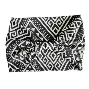 Close-up of black and white bohemian geometric print cotton headband with twisted knot