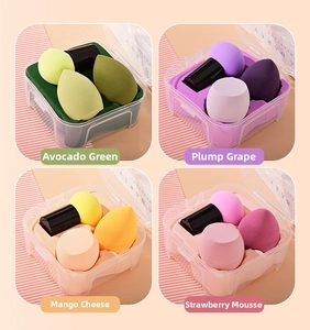 Detail of 4-piece makeup sponge set with three shapes and a black holder in a clear box