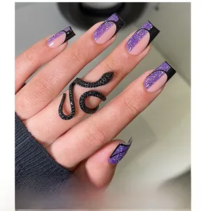 Macro detail of long square nails with black and purple glitter拼接 and snake ring