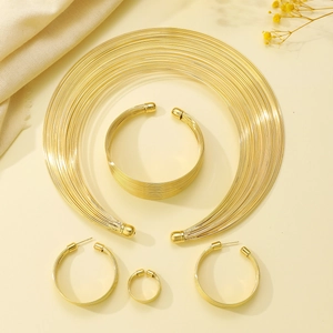 Golden multi-layer punk choker set including chunky bracelet, hoop earrings, and ring