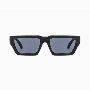 Front detail of trendy small rectangle sunglasses with thick black frames and dark lenses