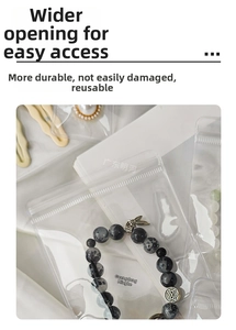 Thickened transparent PVC jewelry pouch showing a beaded bracelet on white silk