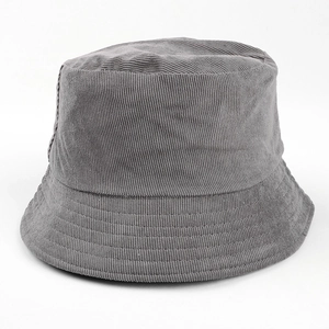 Detail view of a gray corduroy bucket hat showing its soft ribbed fabric texture