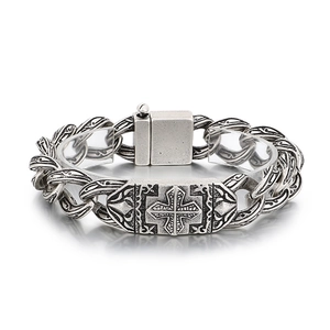 Vintage silver stainless steel bracelet featuring embossed cross and rose patterns