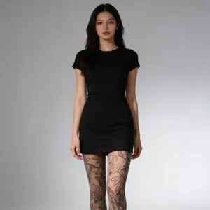 Slim fit short sleeve black dress paired with elegant floral jacquard lace tights