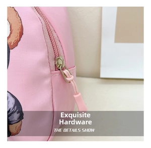Macro detail of high-quality golden metal zipper and pink fabric on a cute bear bag