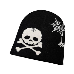 Streetwear knitted beanie featuring white skull and spider web patterns on black fabric