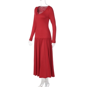 Detail view of red V-neck long sleeve maxi dress with pleated skirt on mannequin