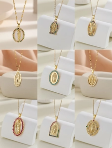 Detail view of gold-plated Virgin Mary pendants featuring colorful zircon micro-inlays