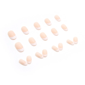 Minimalist French tip press-on nails in nude pink and white with a glossy oval shape