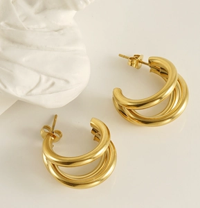 Detailed view of 18K gold plated triple hoop earrings with minimalist aesthetic
