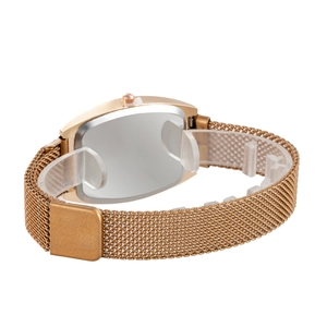 Detail of rose gold mesh watch strap and polished stainless steel back on display stand