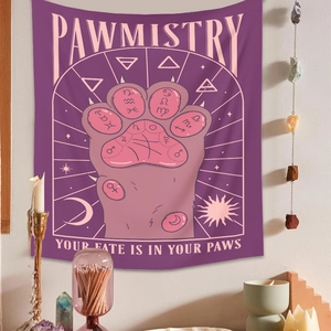 Detail of mystical pawmistry tapestry with cat paw design and astrology symbols
