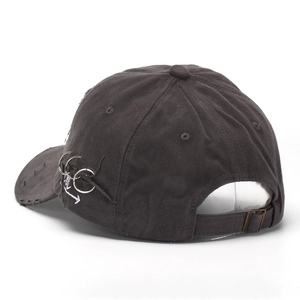 Distressed dark grey baseball cap with metal rings and white embroidery detailing