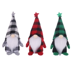 Three Christmas gnomes set with plaid hats and sequin stars for holiday home decoration